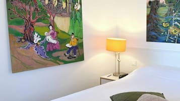 Premium bedding, desk, laptop workspace, soundproofing