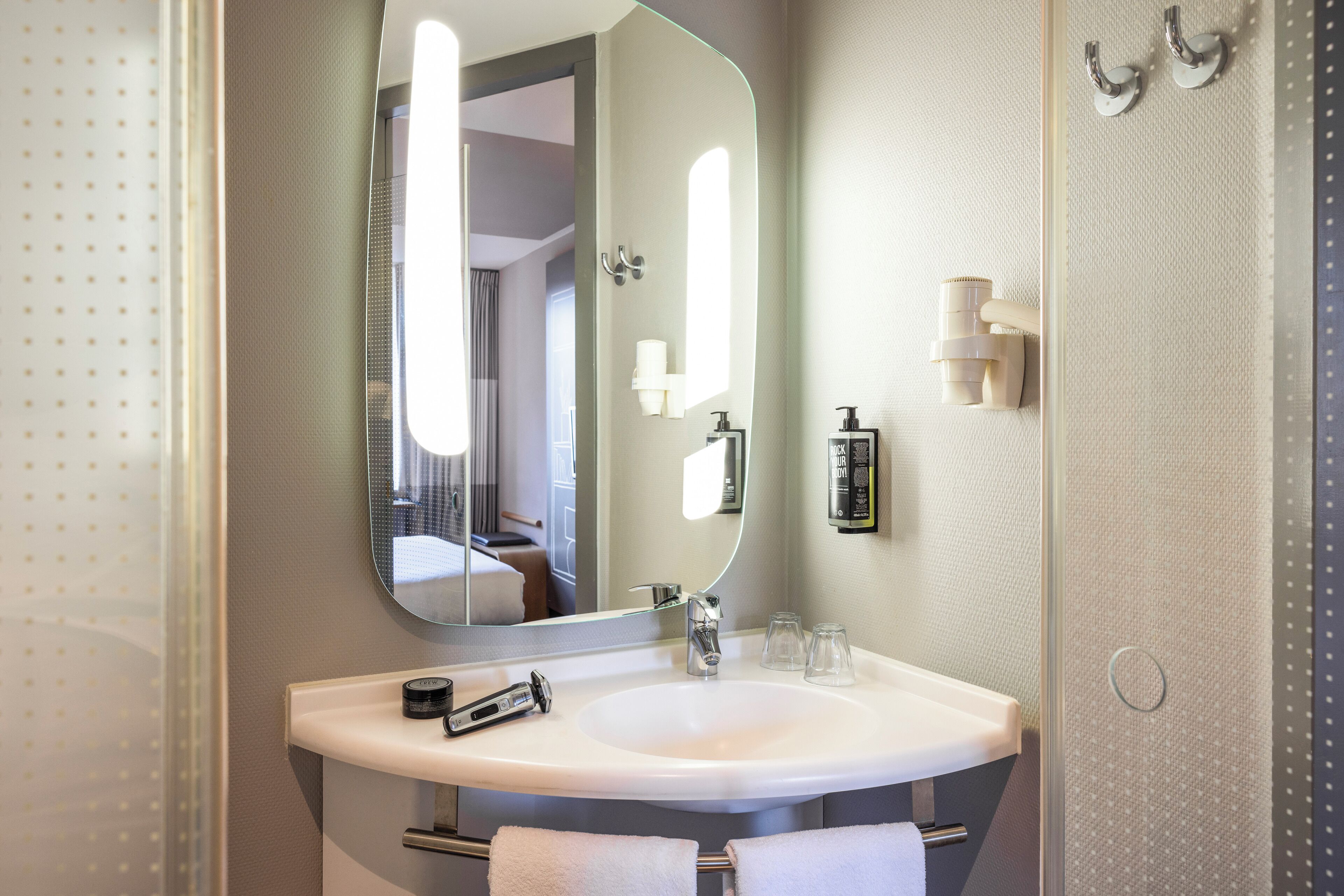 Shower, eco-friendly toiletries, hair dryer, towels