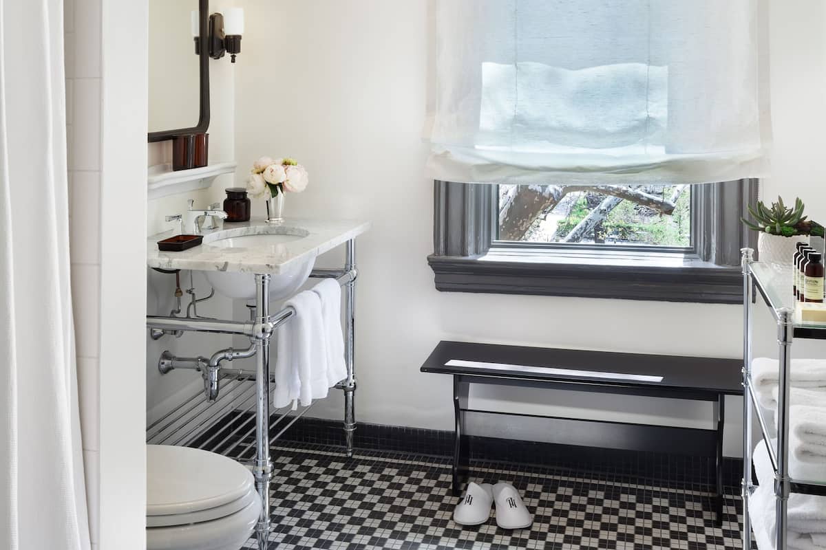 Combined shower/bathtub, designer toiletries, hair dryer, bathrobes