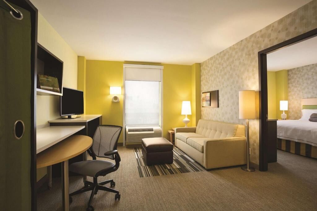 Hypo-allergenic bedding, in-room safe, laptop workspace