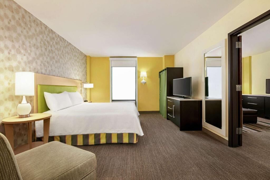 Hypo-allergenic bedding, in-room safe, laptop workspace