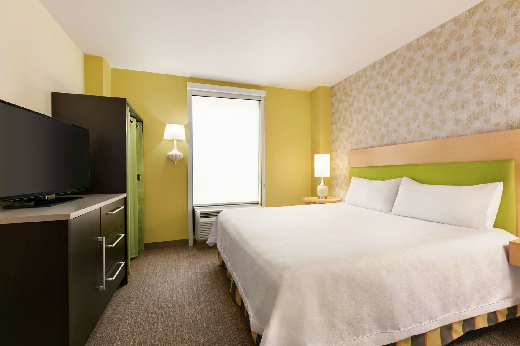 Hypo-allergenic bedding, in-room safe, laptop workspace
