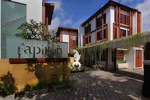 A modern building with a sign reading "Papilon".