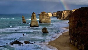 A coastal landscape with prominent rock formations and a beach. - Twelve Apostles Motel & Country Retreat (Princetown)