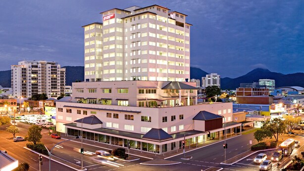 A multi-story hotel with a modern design, featuring a prominent entrance and multiple balconies. - Cairns Central Plaza Apartment Hotel (Cairns)