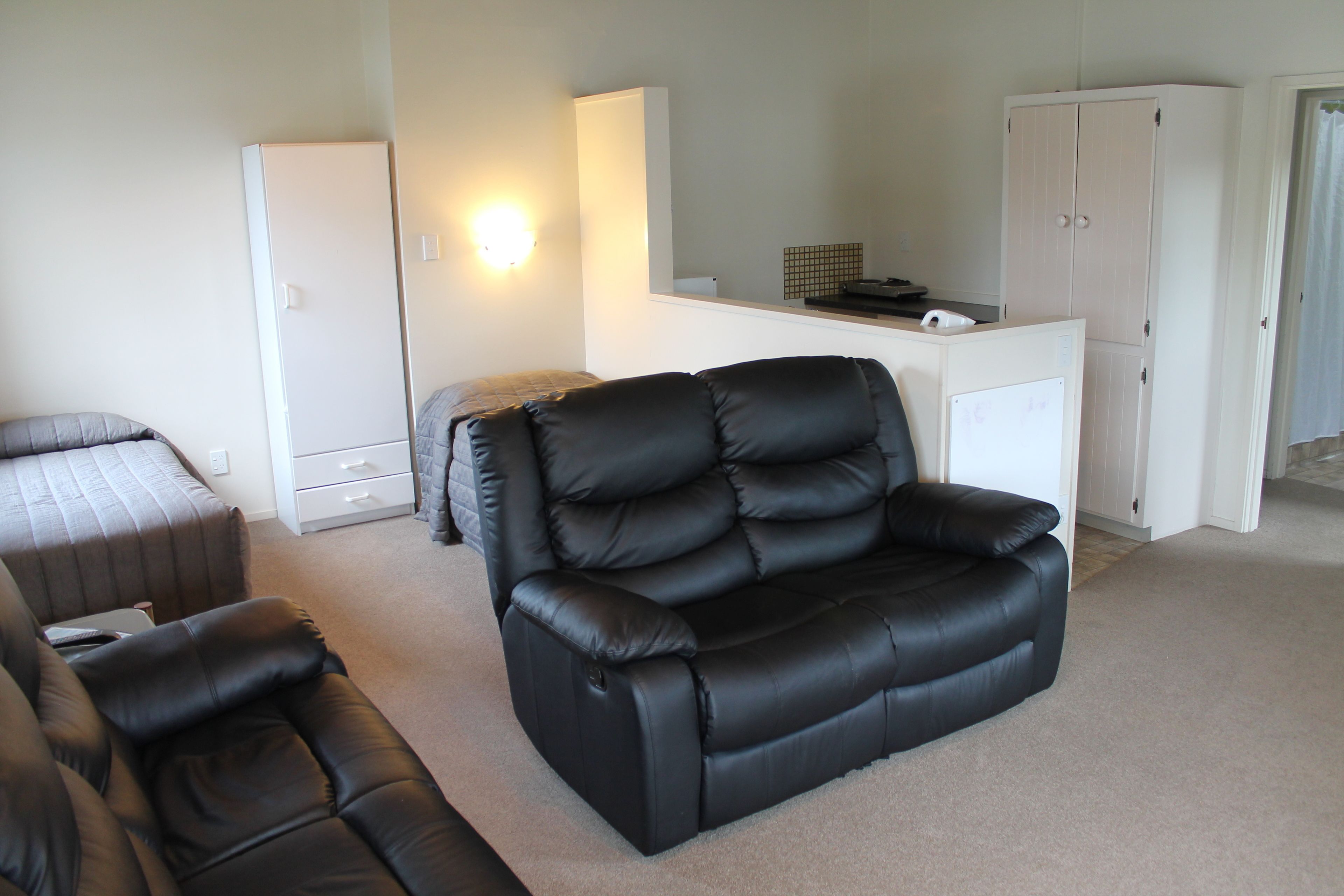 Riverview Unit | Living area | Flat-screen TV