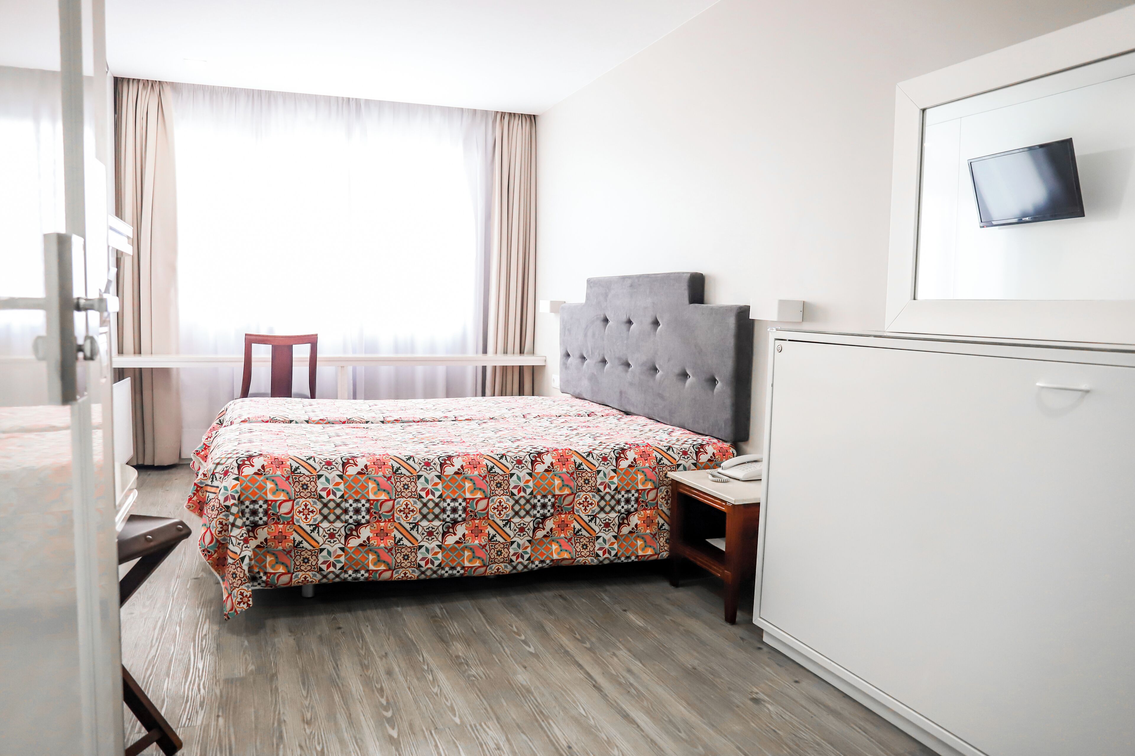 basic triple room | in-room safe, desk, rollaway beds, free wifi