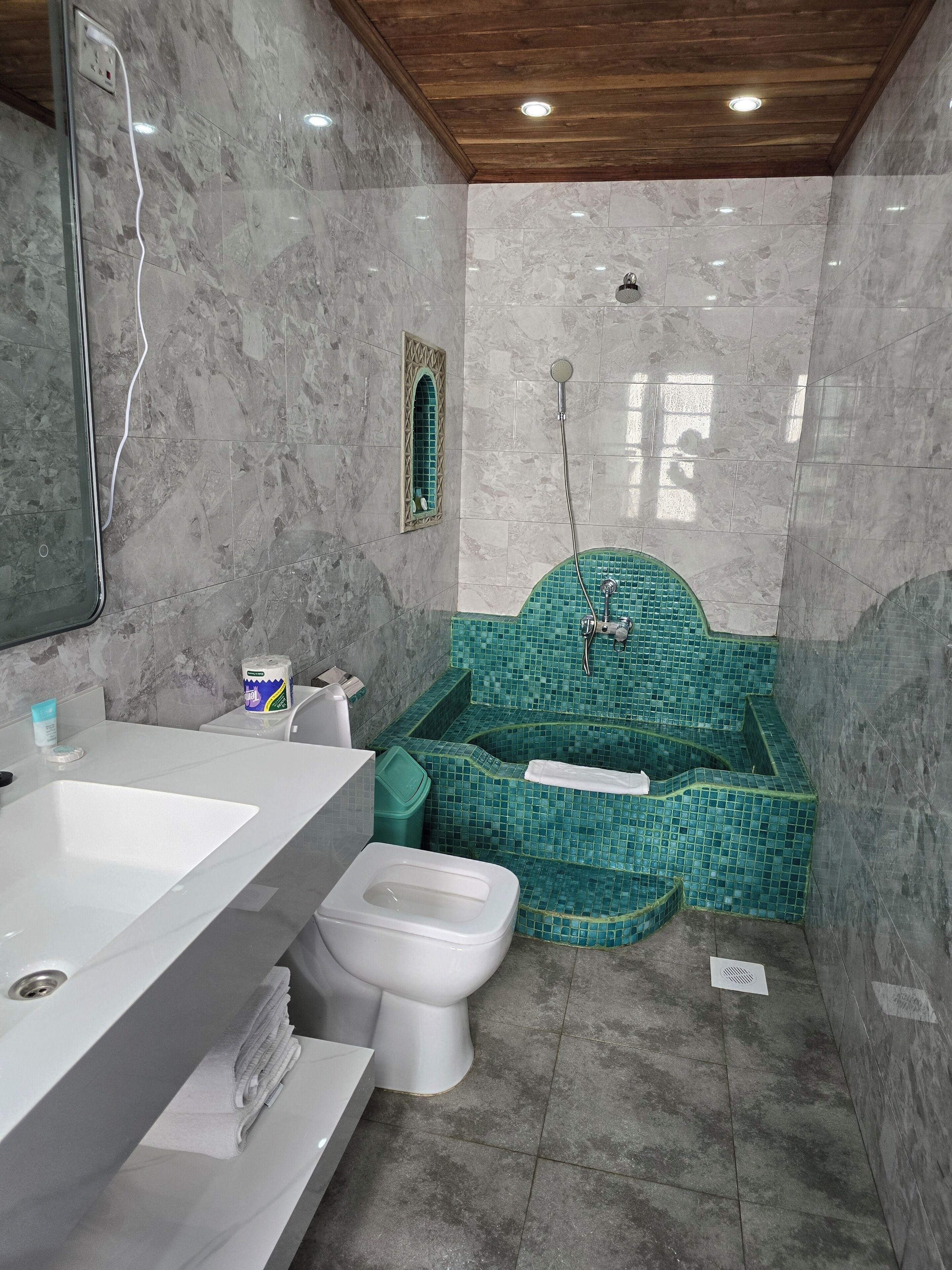 standard triple room, city view | bathroom | shower, hair dryer, slippers, towels