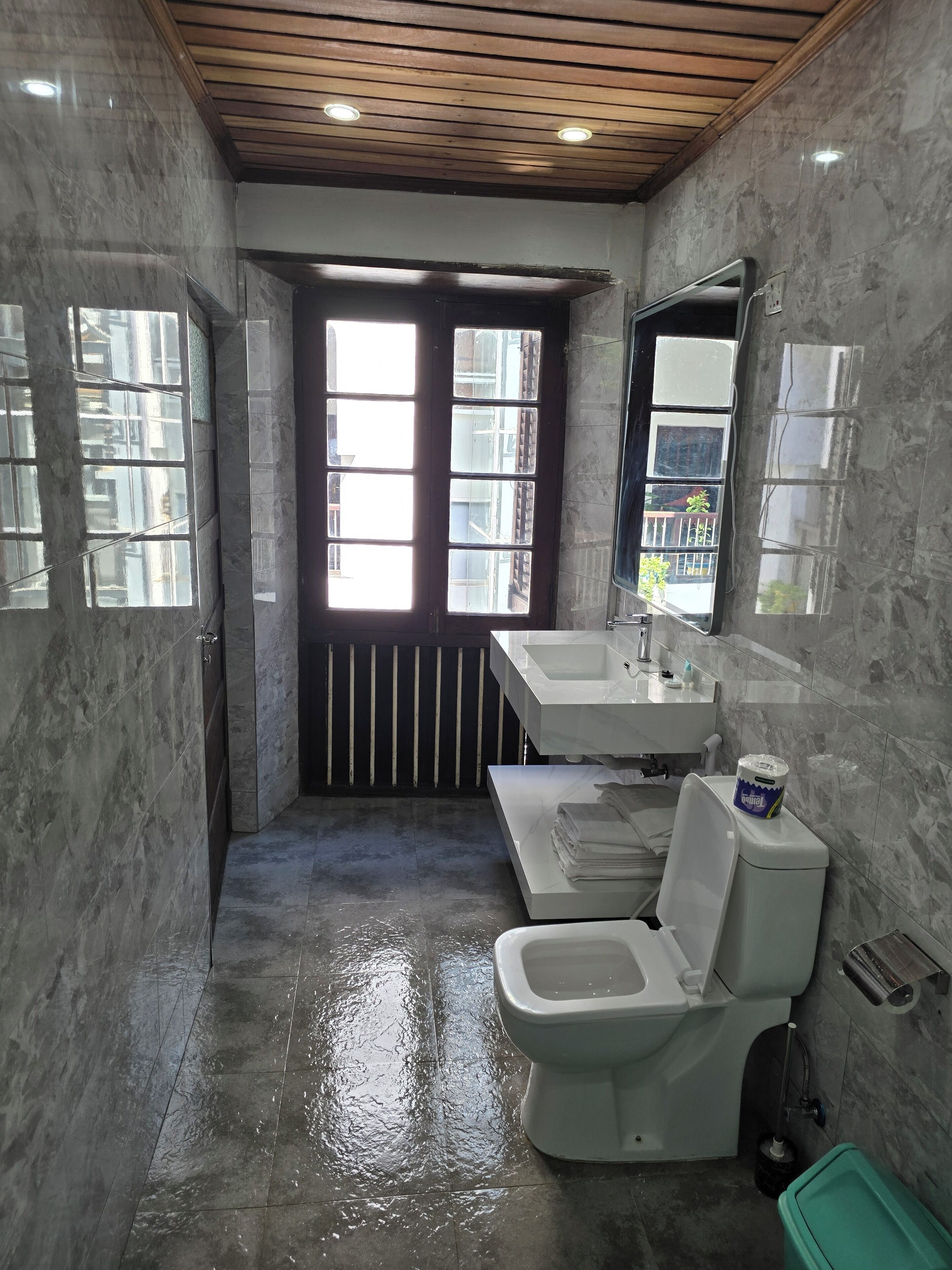 standard triple room, city view | bathroom | shower, hair dryer, slippers, towels