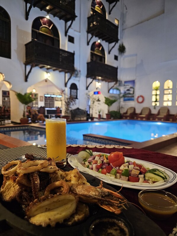 Breakfast, lunch, dinner served; pool views