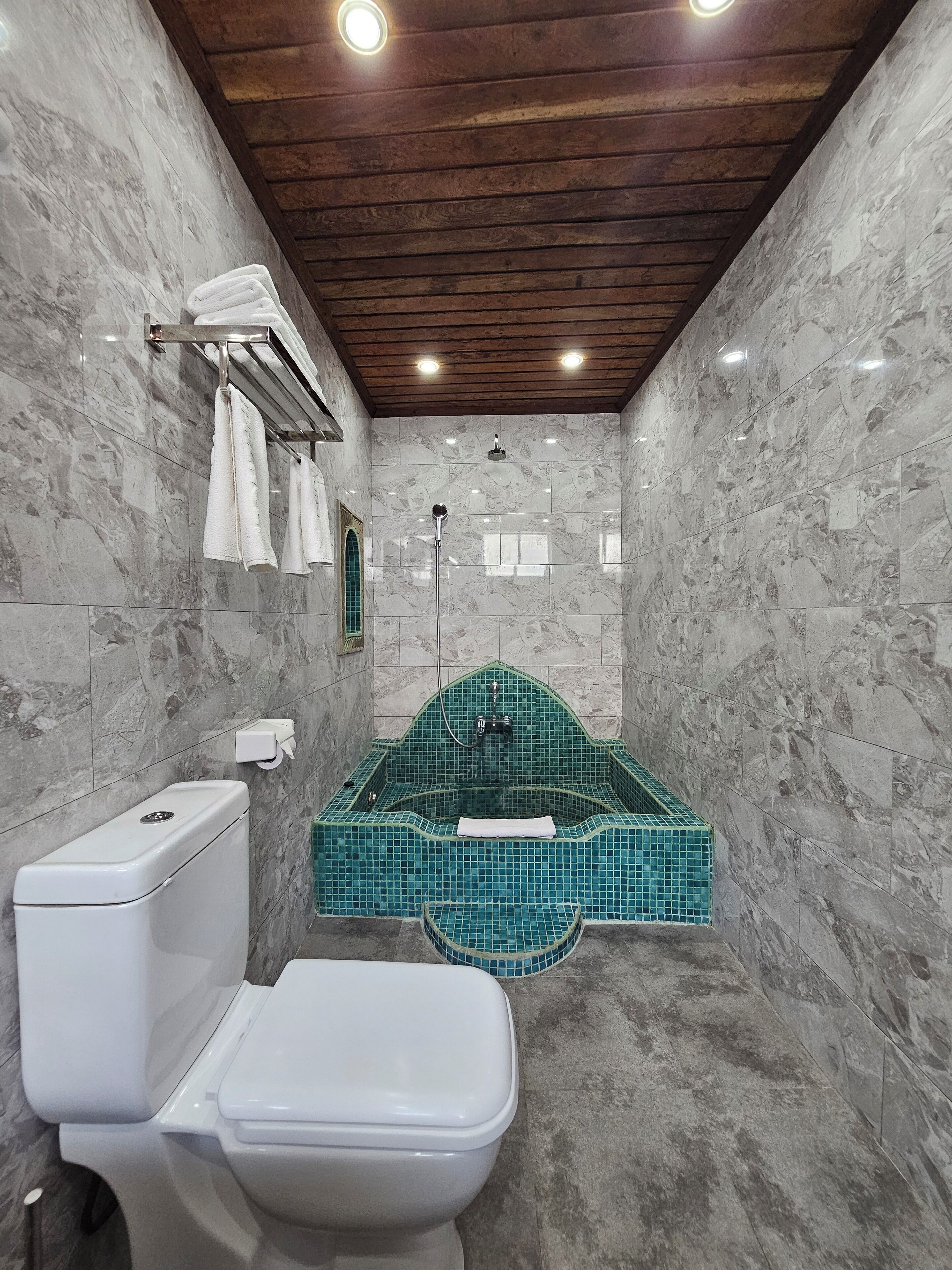 deluxe triple room | bathroom | shower, hair dryer, slippers, towels