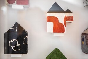 A collection of three-dimensional house models with distinct shapes and colors, displayed against a plain background. - Villa Belverde (Carrara)