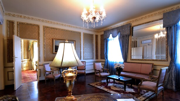A luxurious room with a chandelier, a sofa, armchairs, a coffee table, and a lamp. - Windsor Palace Luxury Heritage Hotel Since 1906 by Paradise Inn Group (Alexandria)