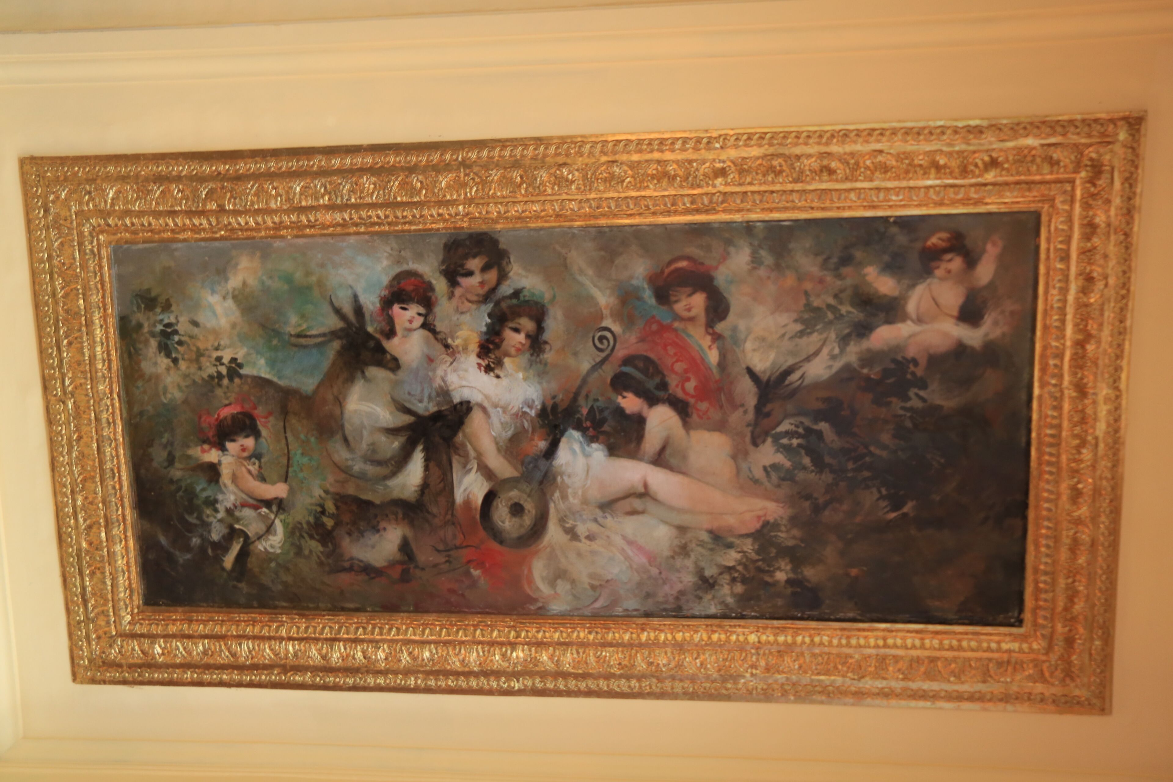 Un tableau classique, encadré d’un cadre doré, représentant plusieurs personnages dans un décor champêtre.