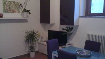 Comfort Apartment, 3 Bedrooms | Living area | Flat-screen TV