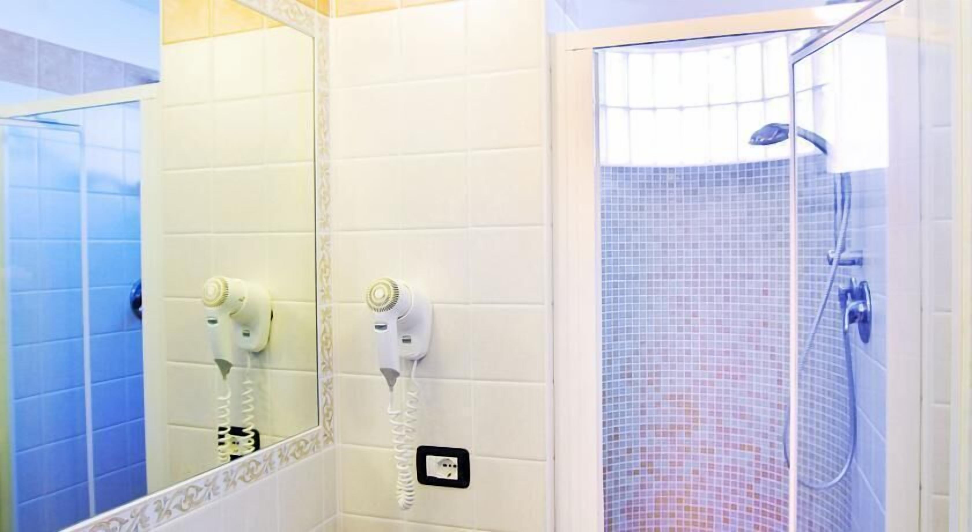 shower, hair dryer, bidet, towels