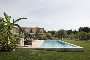 Seasonal outdoor pool, pool loungers