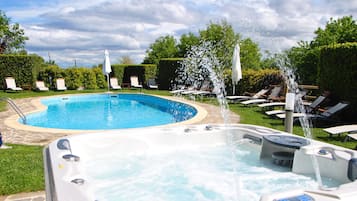 Seasonal outdoor pool, a rooftop pool, pool umbrellas, pool loungers