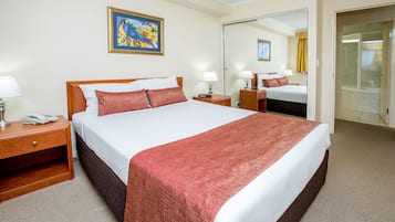 Apartment, 1 Bedroom | Minibar, desk, blackout drapes, iron/ironing board