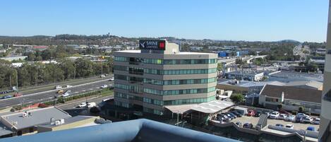A multi-story building with a sign for "Shine Lawyers" on the top.