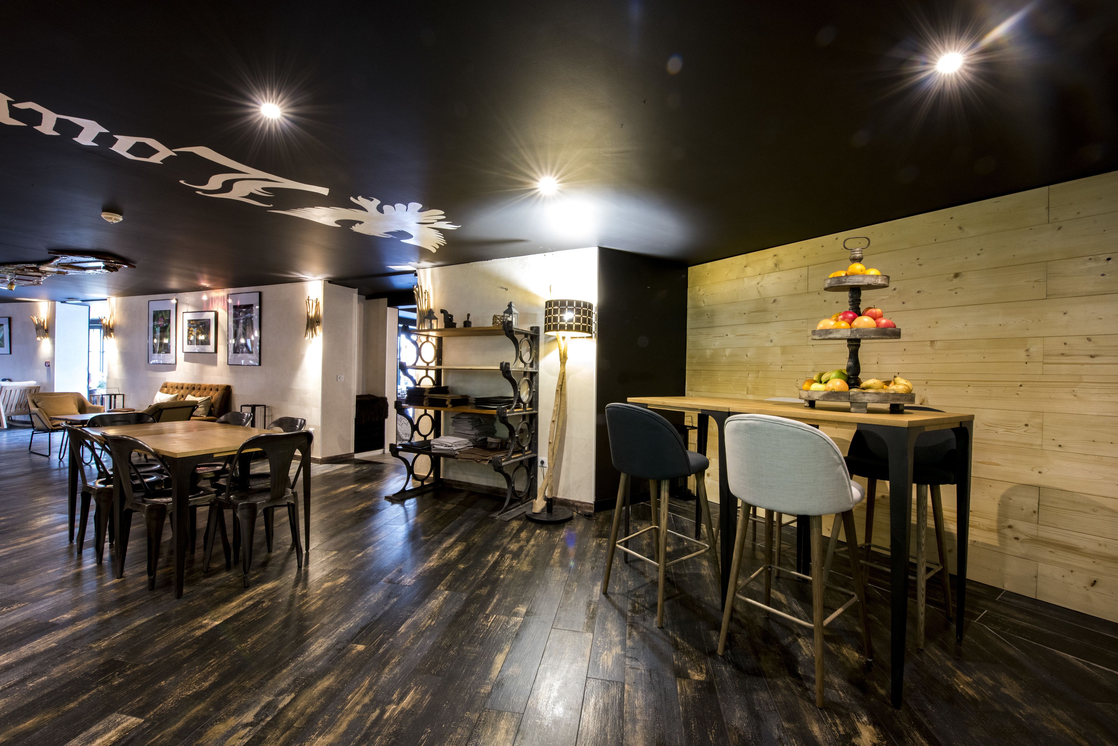 A restaurant with a wooden interior, a bar area, and a seating arrangement.