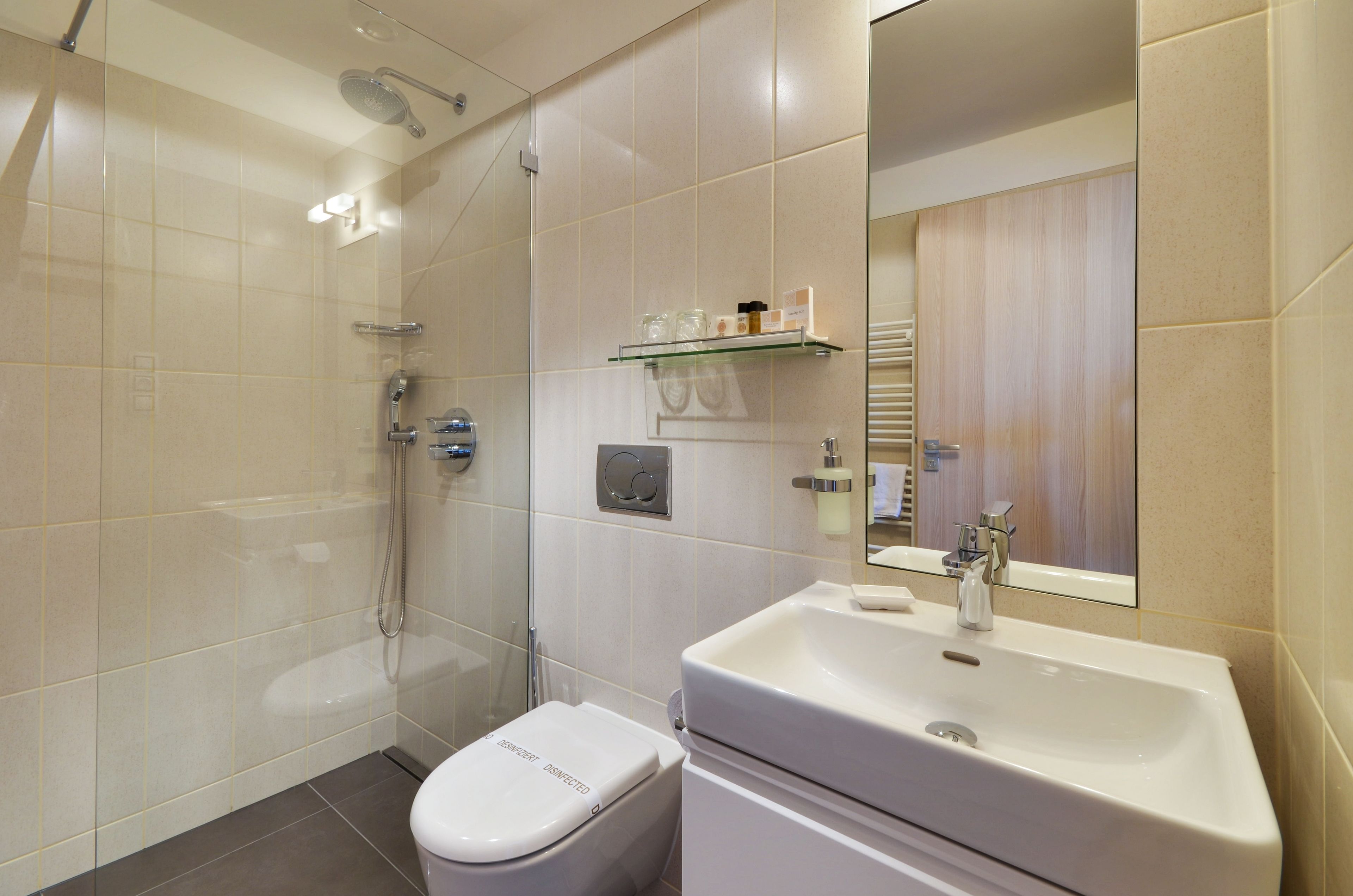 superior double room | bathroom | shower, rainfall showerhead, free toiletries, hair dryer
