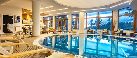 Indoor pool, open 9:00 AM to 8:00 PM, pool loungers, lifeguards on site