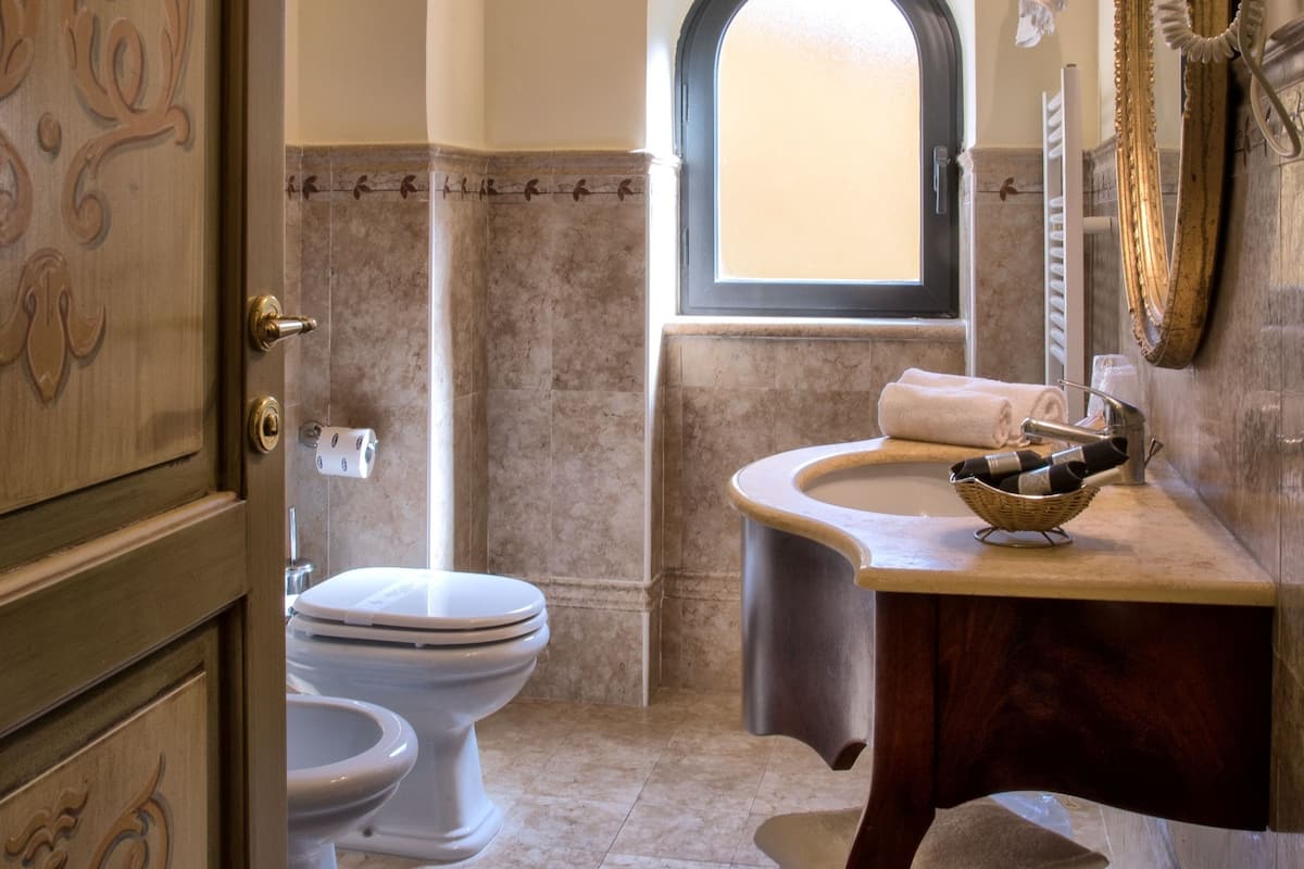 quadruple room | bathroom | shower, free toiletries, hair dryer, slippers