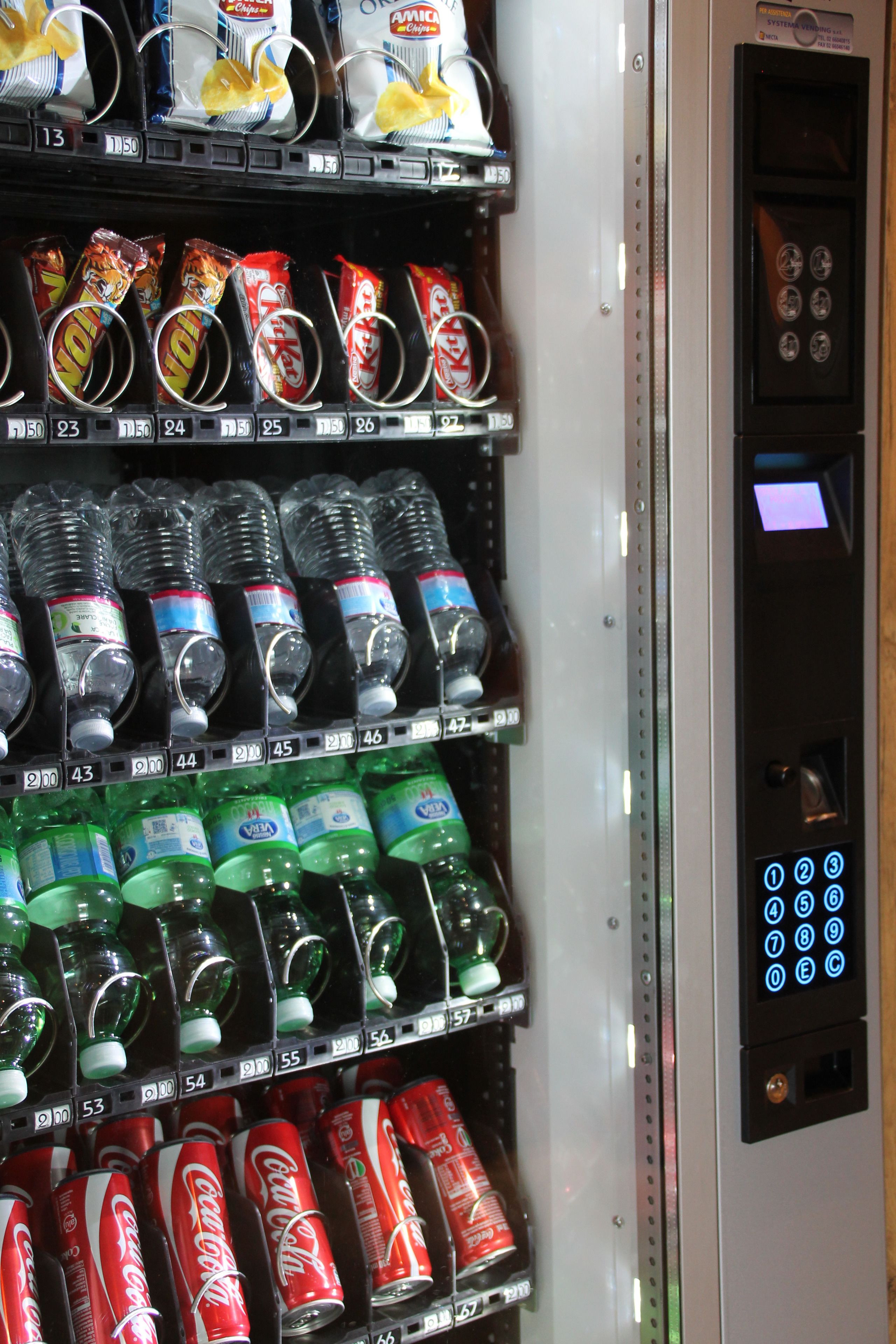 A vending machine with various drinks and snacks.