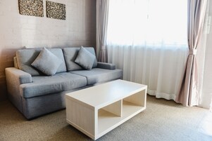 Deluxe Queen | Living area | LCD TV