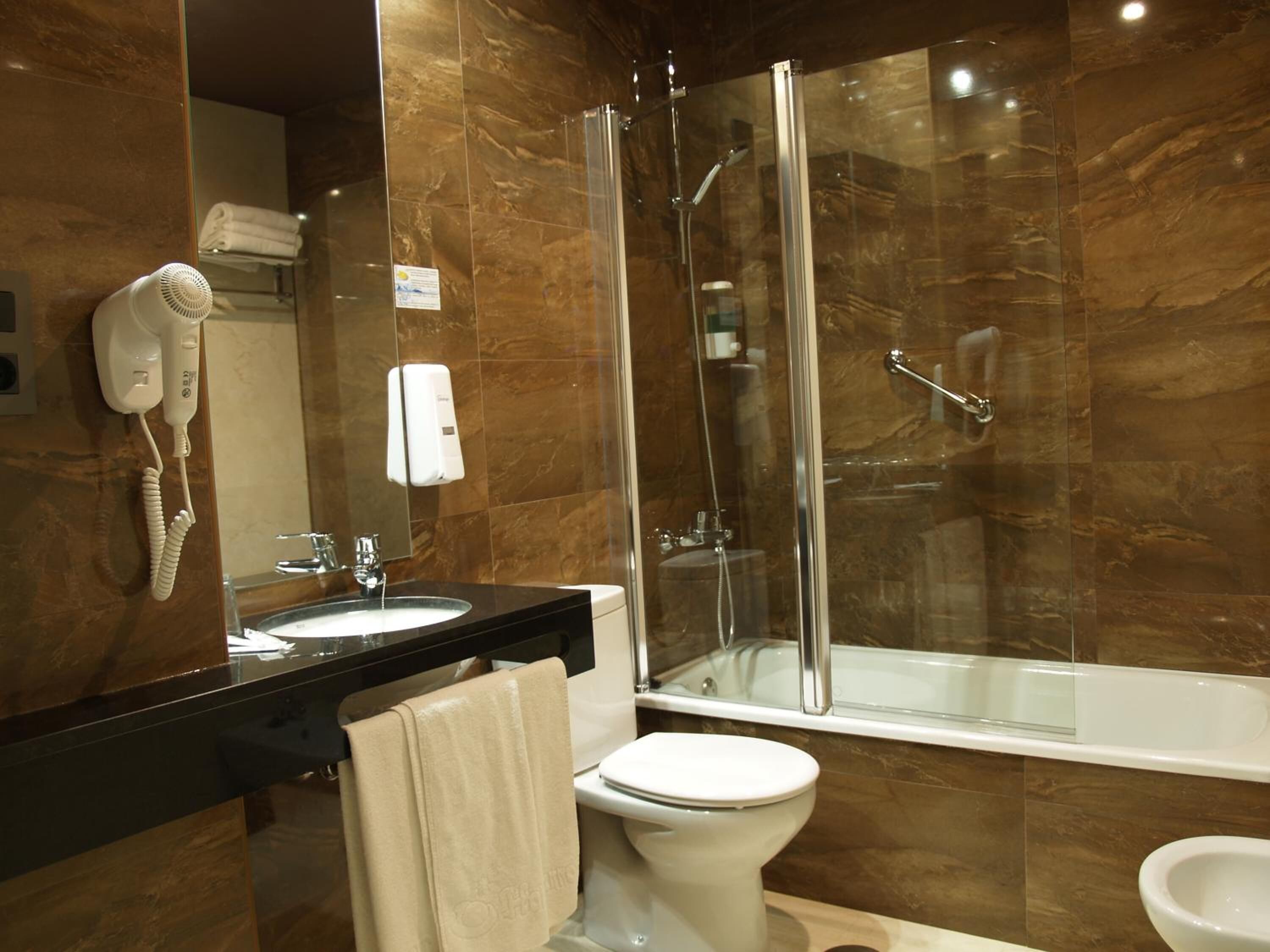 free toiletries, hair dryer, bidet, towels