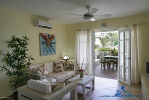 Apartment, 1 King Bed, Terrace, Sea View | Living area | 32-inch plasma TV with satellite channels, TV, first-run movies