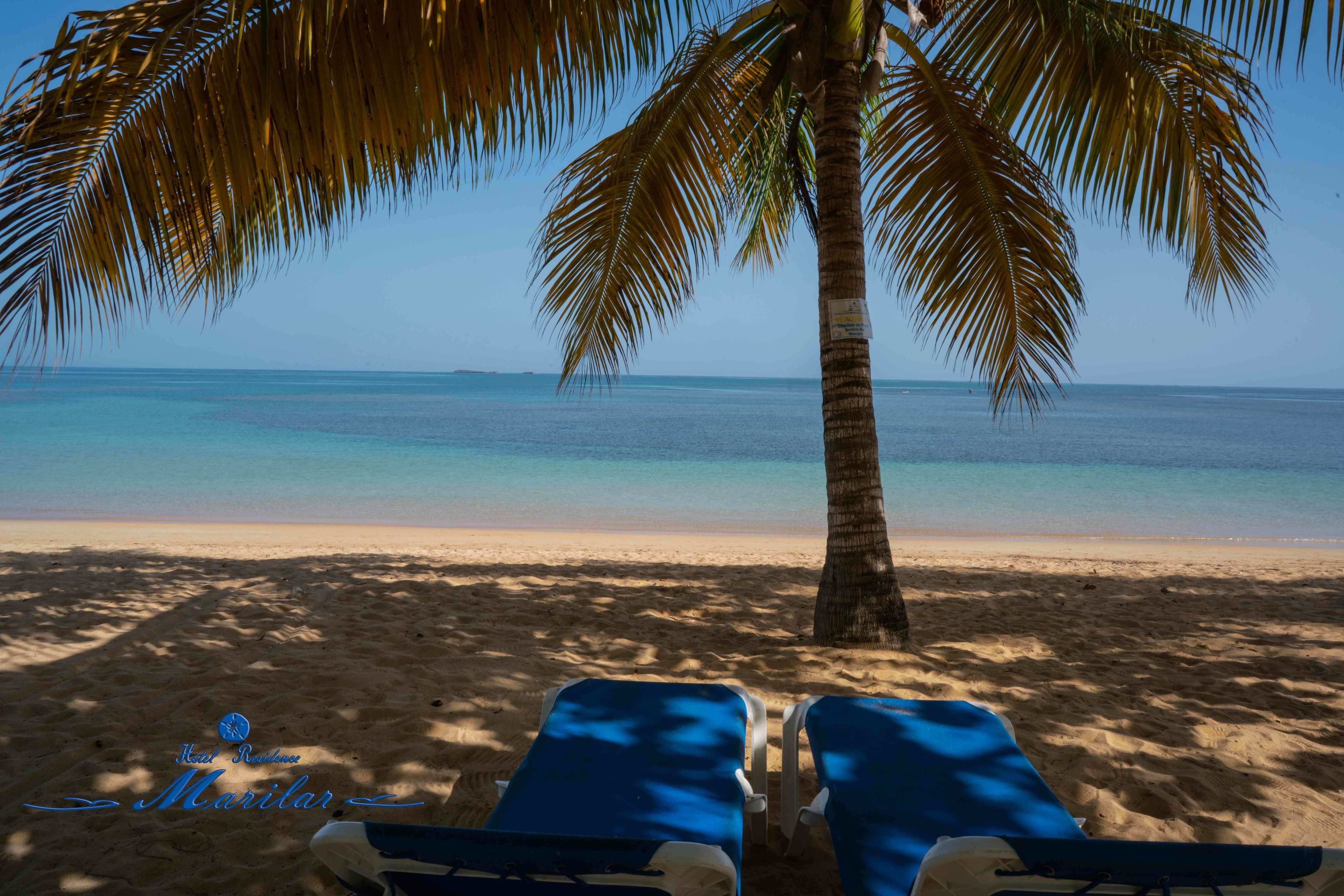 Private beach, white sand, sun loungers, beach towels