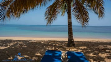 Private beach, white sand, sun loungers, beach towels