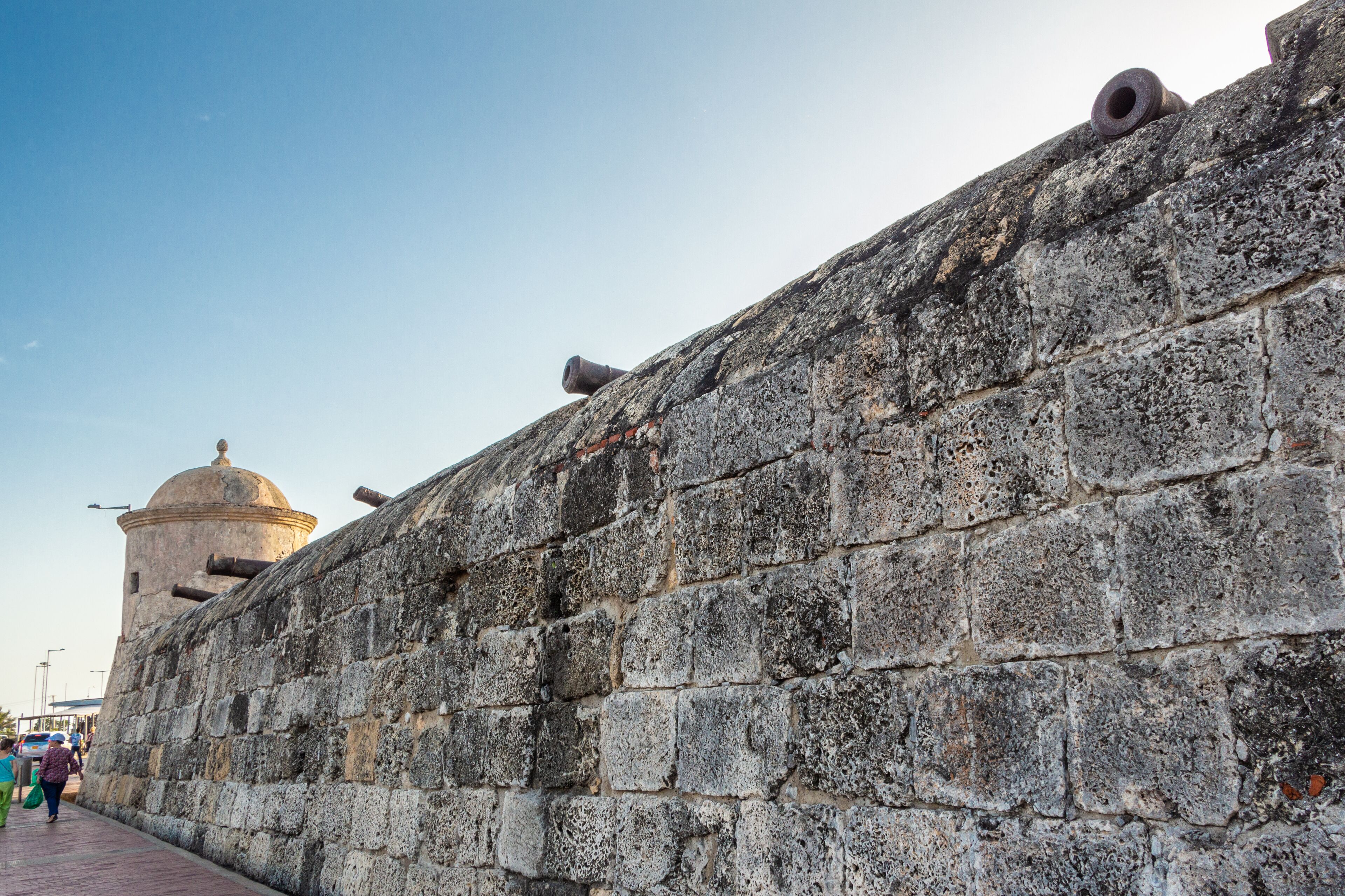 A stone wall with a dome structure and cannons.