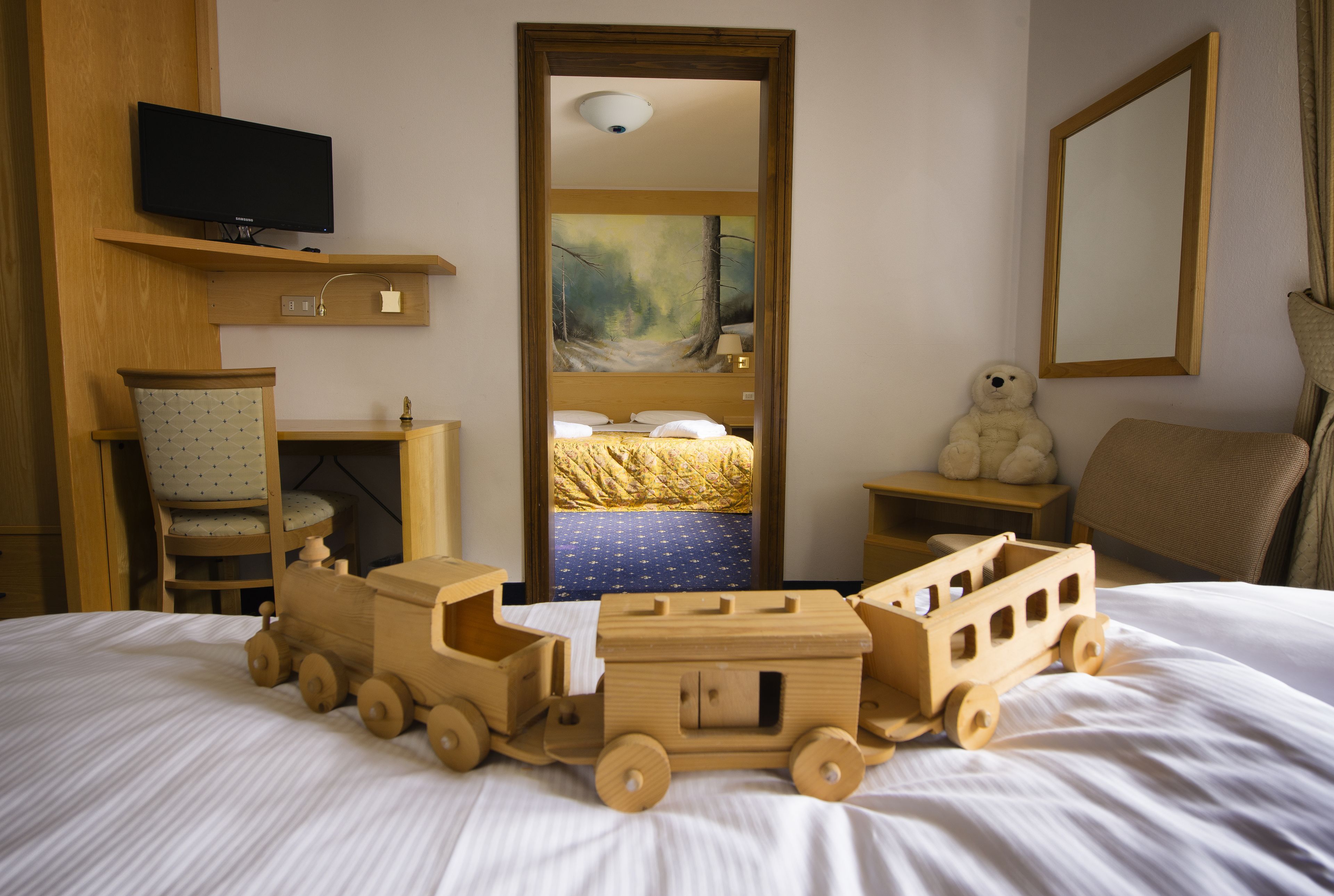 classic quadruple room | minibar, in-room safe, desk, blackout curtains