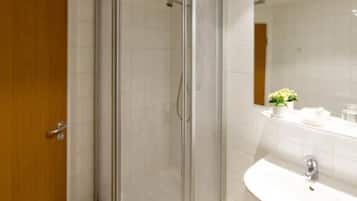 Shower, free toiletries, hair dryer, slippers