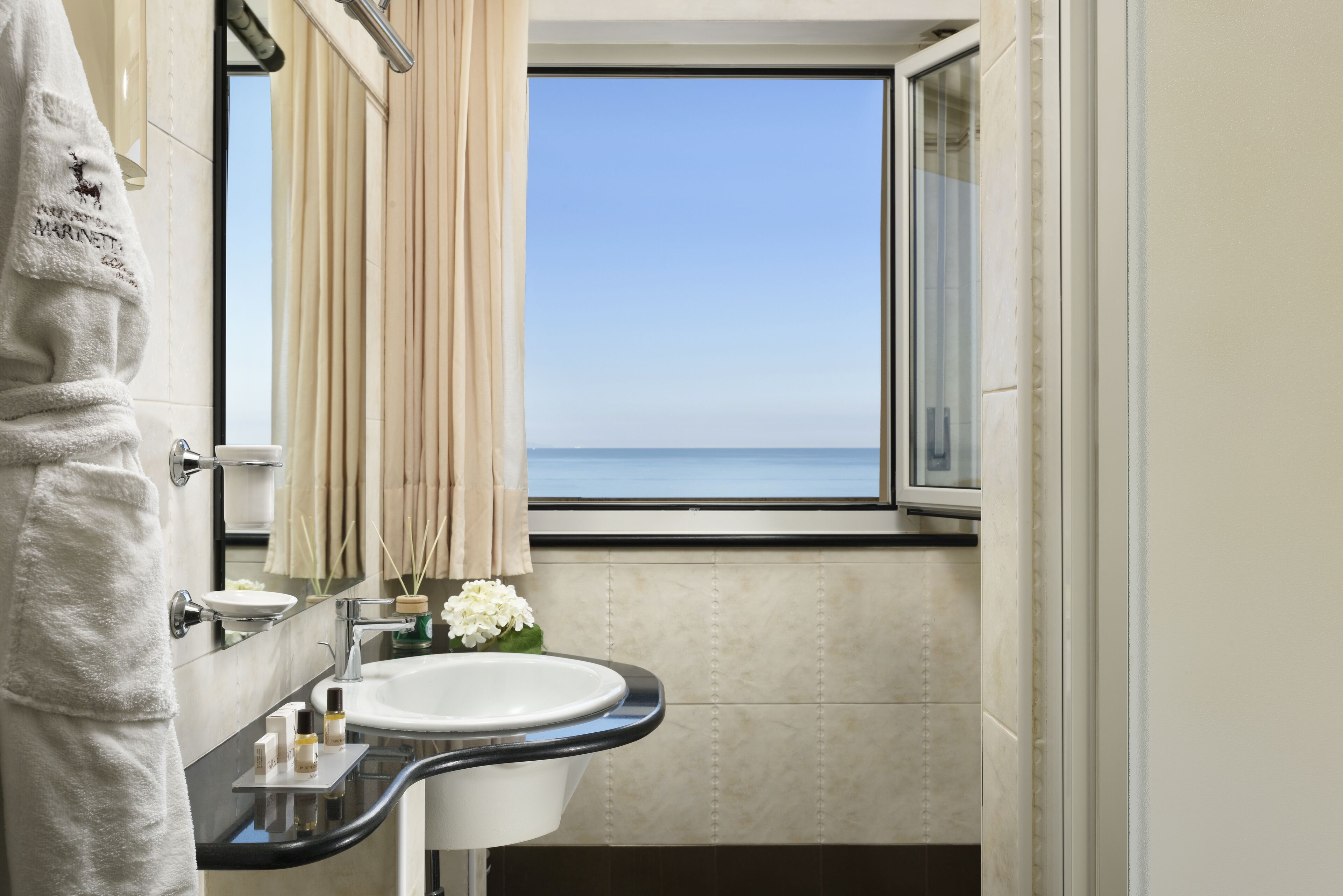 superior double room, balcony, partial sea view | bathroom | combined shower/bathtub, eco-friendly toiletries, hair dryer, slippers