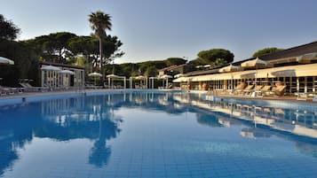Indoor pool, outdoor pool, open 9 AM to 7 PM, pool loungers