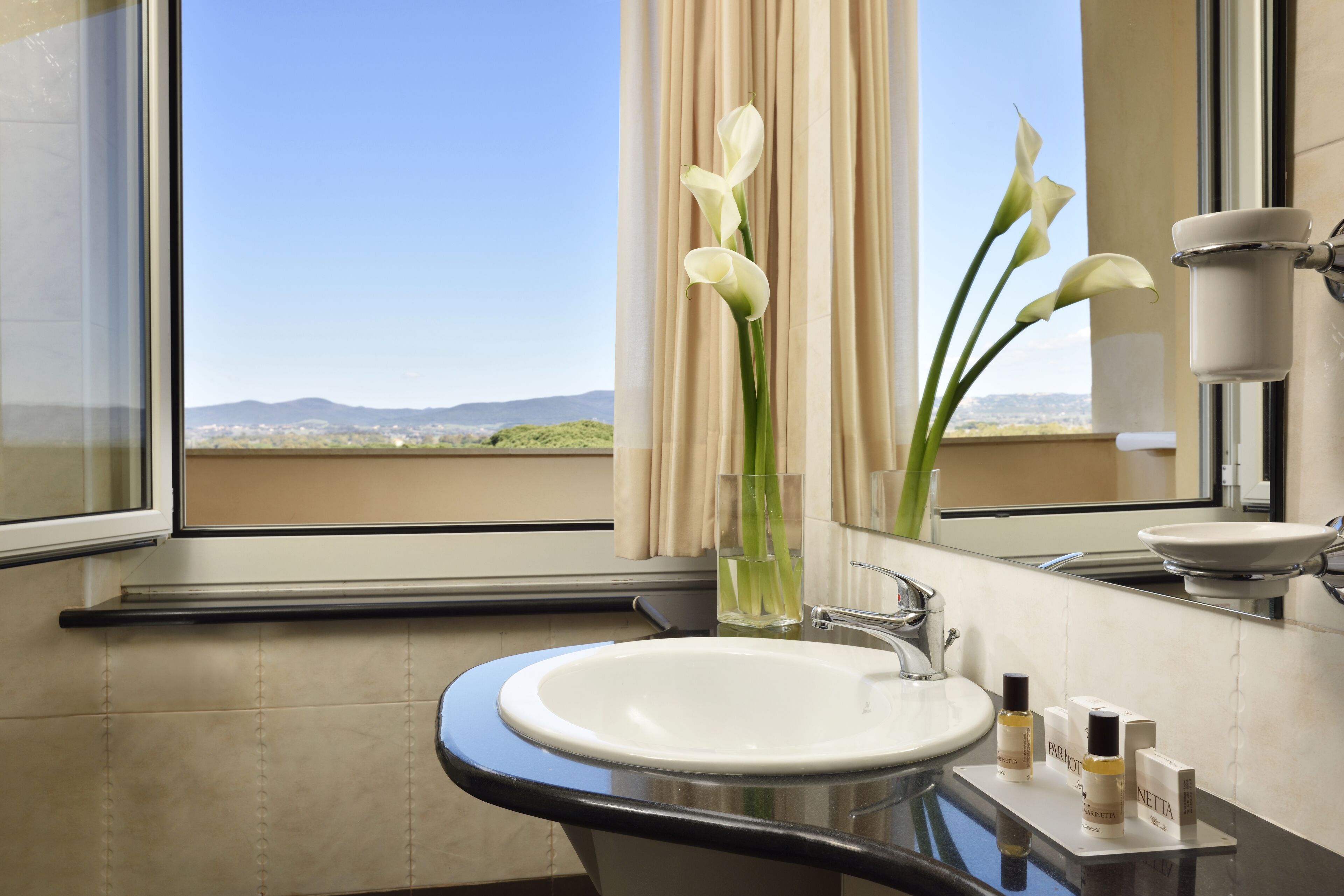 junior suite, balcony, sea view | bathroom | combined shower/bathtub, eco-friendly toiletries, hair dryer, slippers