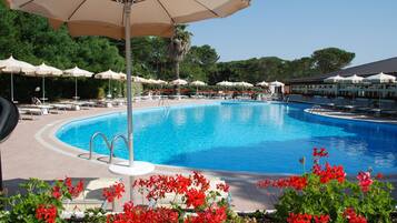 Indoor pool, outdoor pool, open 9 AM to 7 PM, pool loungers