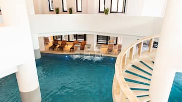 Indoor pool, seasonal outdoor pool, pool umbrellas, pool loungers