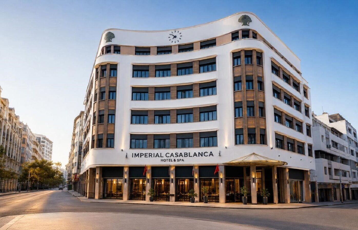 A multi-story hotel with a prominent clock on the facade, named 'Imperial Casablanca Hotel & Spa'.