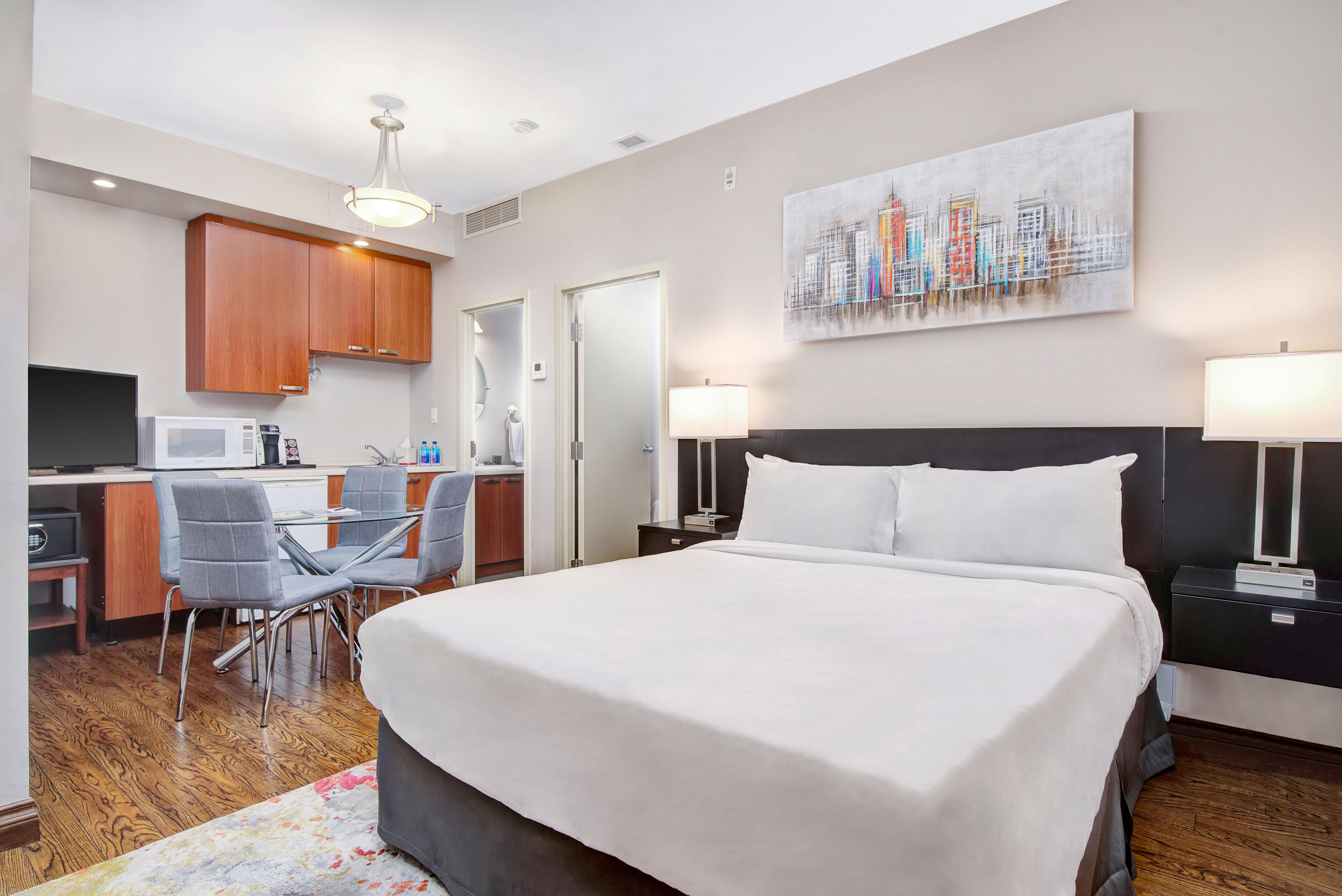 family suite, multiple beds, kitchenette | living area | 32-inch lcd tv with cable channels, tv