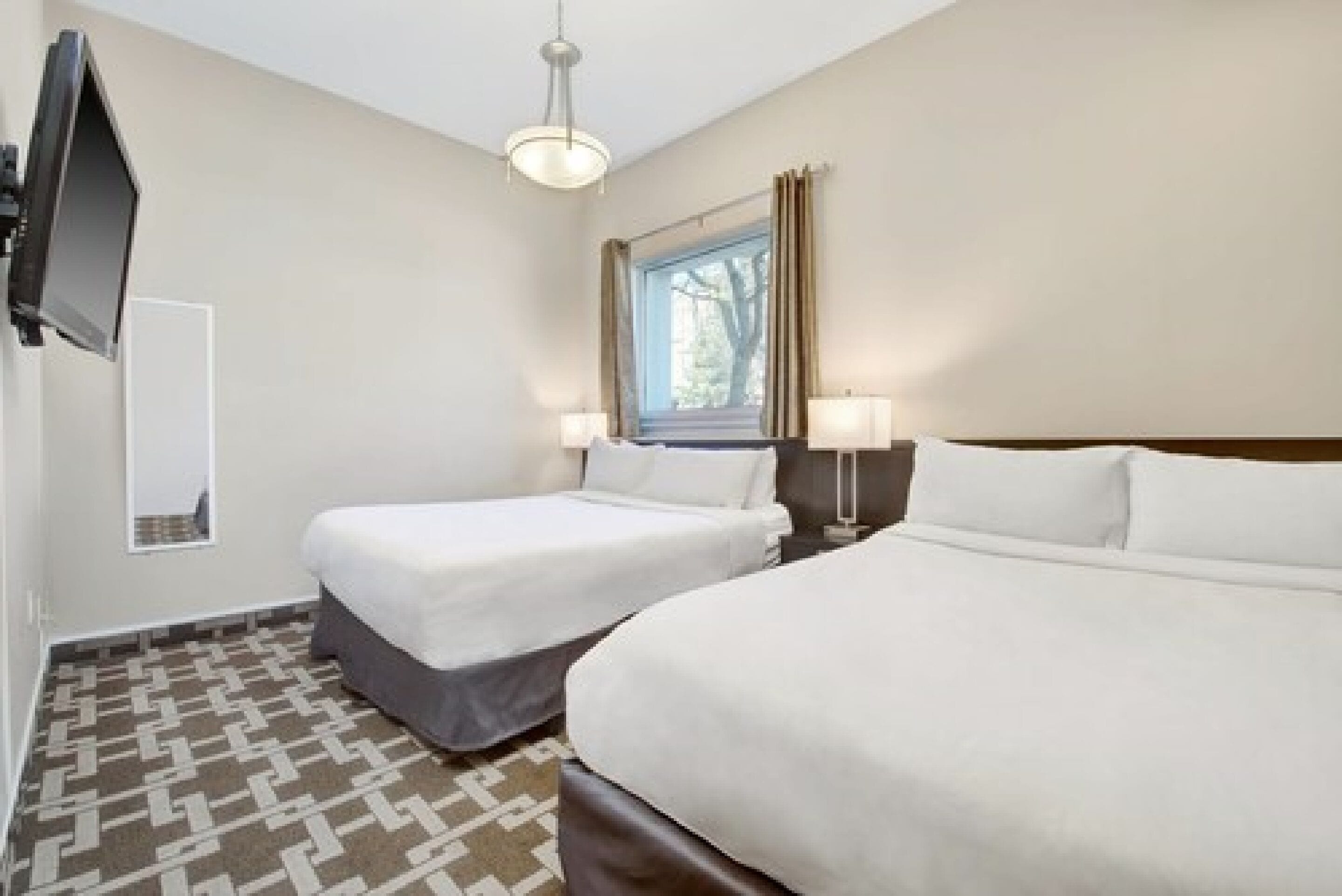 family suite, multiple beds, kitchenette | 2 bedrooms, premium bedding, pillow-top beds, in-room safe