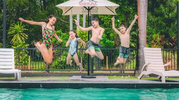 Outdoor pool, open 8 AM to 8 PM, pool loungers