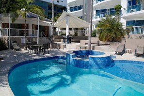 Outdoor pool, pool umbrellas, sun loungers