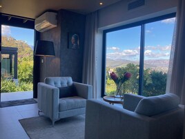 Bay View Suite | Living area | 43-inch Smart TV with cable channels, books, heated floors