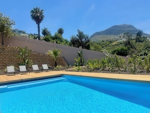 Outdoor pool, pool umbrellas, sun loungers
