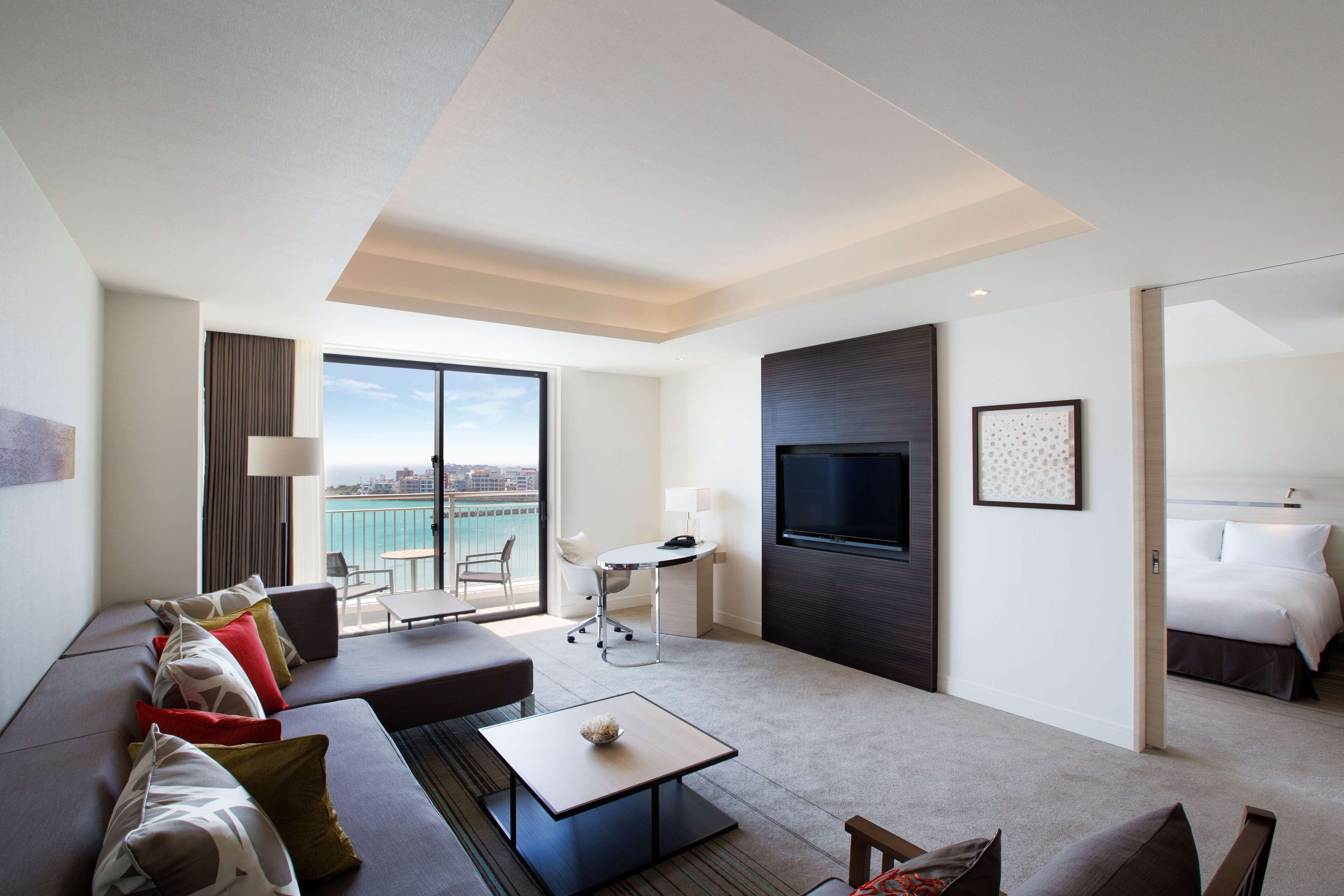 king one bedroom suite with ocean view - balcony | living area | 50-inch tv with cable channels, dvd player